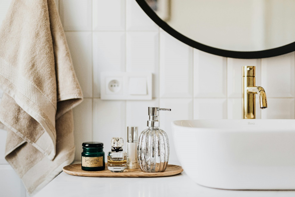 Skincare products near a sink 